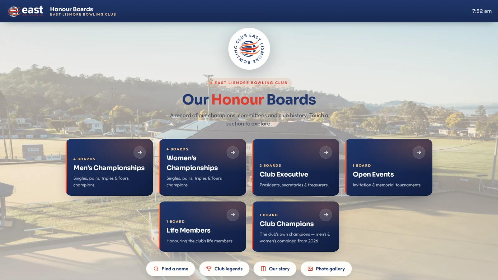 East Lismore Bowling Club honour-board kiosk — board categories over an aerial of the greens